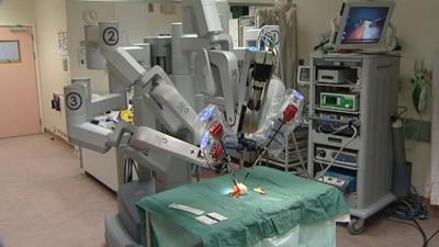 The Da Vinci robot at Southmead Hospital in Bristol demonstrates surgery on a clementine