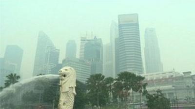 Singapore's skyscrapers behind a haze of smog