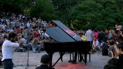 Protester playing the piano