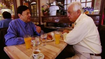 John Simpson chats to Nicholas Snowman in a Paris cafe