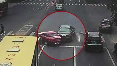 Security footage shows collision between two cars