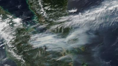 Nasa satellite shows smoke caused by forest fires over southern Malaysia and Singapore