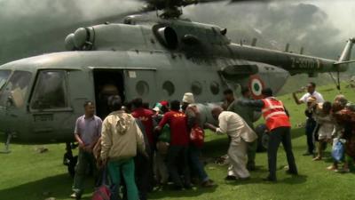 Helicopter collecting stranded people in Uttarakhand