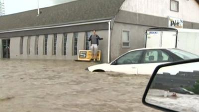 Man and cars surrounded by water in Canada