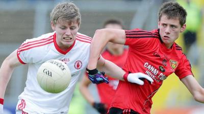 Tyrone's Padraig McGirr with Pat Havern of Down