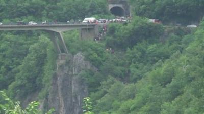 Rescue workers around the site of the crash