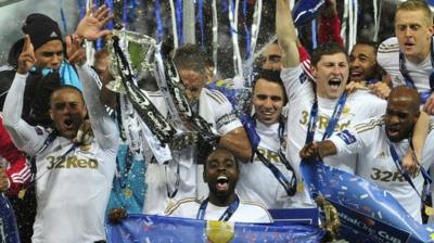 Swansea City celebrate winning the League Cup