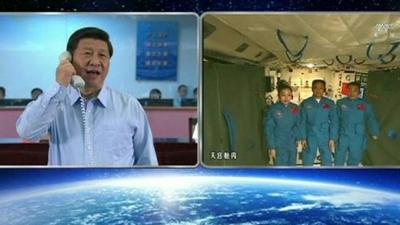 Xi Jinping speaking to astronauts