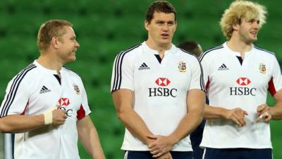 Tom Court with fellow Lions players Ian Evans and Richie Gray in Melbourne