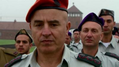 Israeli army officers march at Auschwitz