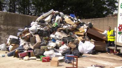 Rubbish piled high after collection