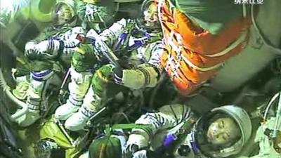 Astronauts in the capsule returning to Earth