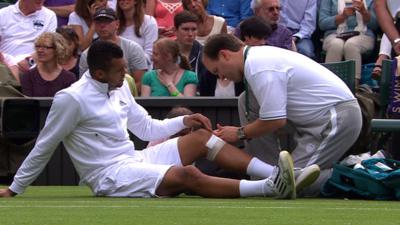 Tsonga receiving treatment