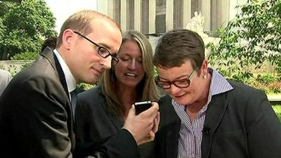 Chris Perry (right) and Sandy Steer listen to President Obama on the phone