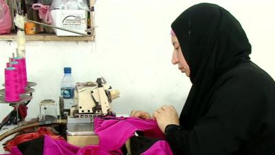 Woman at sewing machine