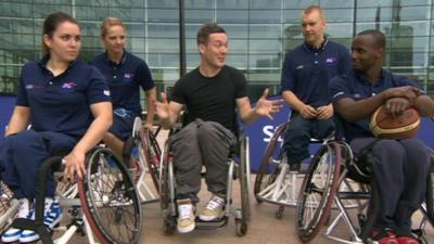 Martin and four wheelchair basketball players