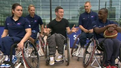 Martin and four wheelchair basketball players