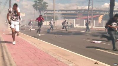 People apparently fleeing tear gas in Fortaleza, Brazil