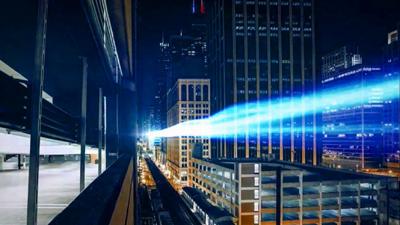 Light streaks through a city at night