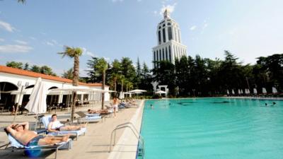 Sunbathers next to a pool at a luxury hotel in Batumi, Georgia