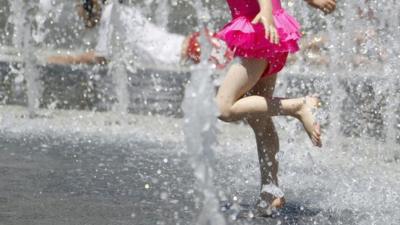 Betty Lu Guapo, 4, cools off in the heat at the Los Angeles Fountain