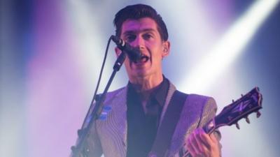 Alex Turner of the Arctic Monkeys performs live on the Pyramid Stage at day 2 of the 2013 Glastonbury Festival