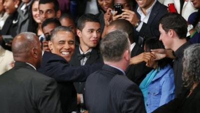 U.S. President Barack Obama greets the public as he arrives to deliver remarks and takes questions at a town hall meeting with young African leaders at the University of Johannesburg Soweto campus Saturday June 29