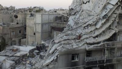 A view of buildings damaged by what activists say was shelling by forces loyal to President Bashar al-Assad in the Khalidiya neighbourhood of Homs on Friday