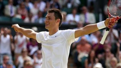 Bernard Tomic celebrates his victory over Richard Gasquet