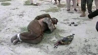 Alleged would-be suicide bomber lying on the ground with hands tied