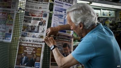 Man with newspapers in Portugal