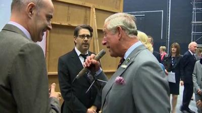 Prince Charles speaks into the Dalek voice machine