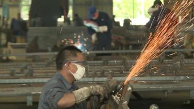 Worker in Chinese metal factory