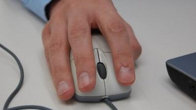 Man using a laptop mouse