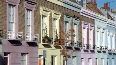 Multi-coloured Victoria terraced houses in Camden Town, north London.