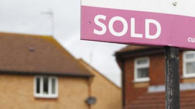 File photo dated 02/10/2012 of a general view of an estate agent"s "Sold" sign outside a property