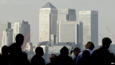 Commuters and London skyline