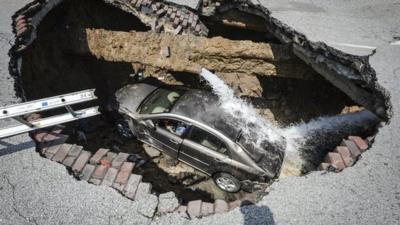 Car stuck in a sinkhole