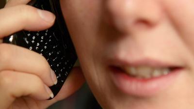 A woman talking on a mobile phone