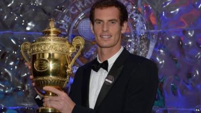 Andy Murray holds mens singles trophy