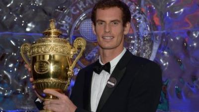 Andy Murray holds mens singles trophy