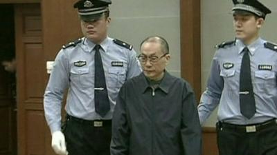 Liu Zhijun is escorted into court