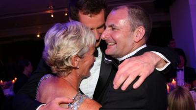 Andy Murray hugs his mum Judy and dad William