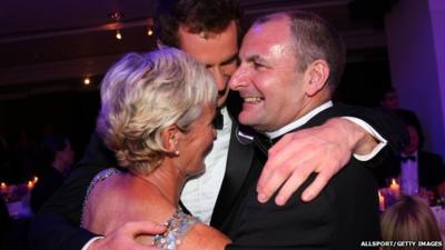 Andy Murray hugs his mum Judy and dad William