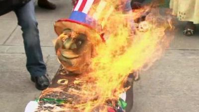 American symbols set on fire by protesters in Bolivia