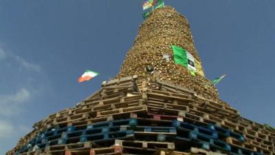 A bonfire built on scrub land on a housing estate