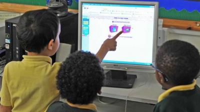 Primary school children working at a computer