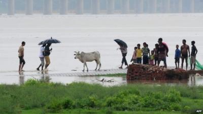 People on flooded road in Uttarakhand