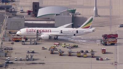 the Ethiopian Airlines Boeing 787 Dreamliner jet and emergency vehicles