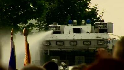 A water cannon being used